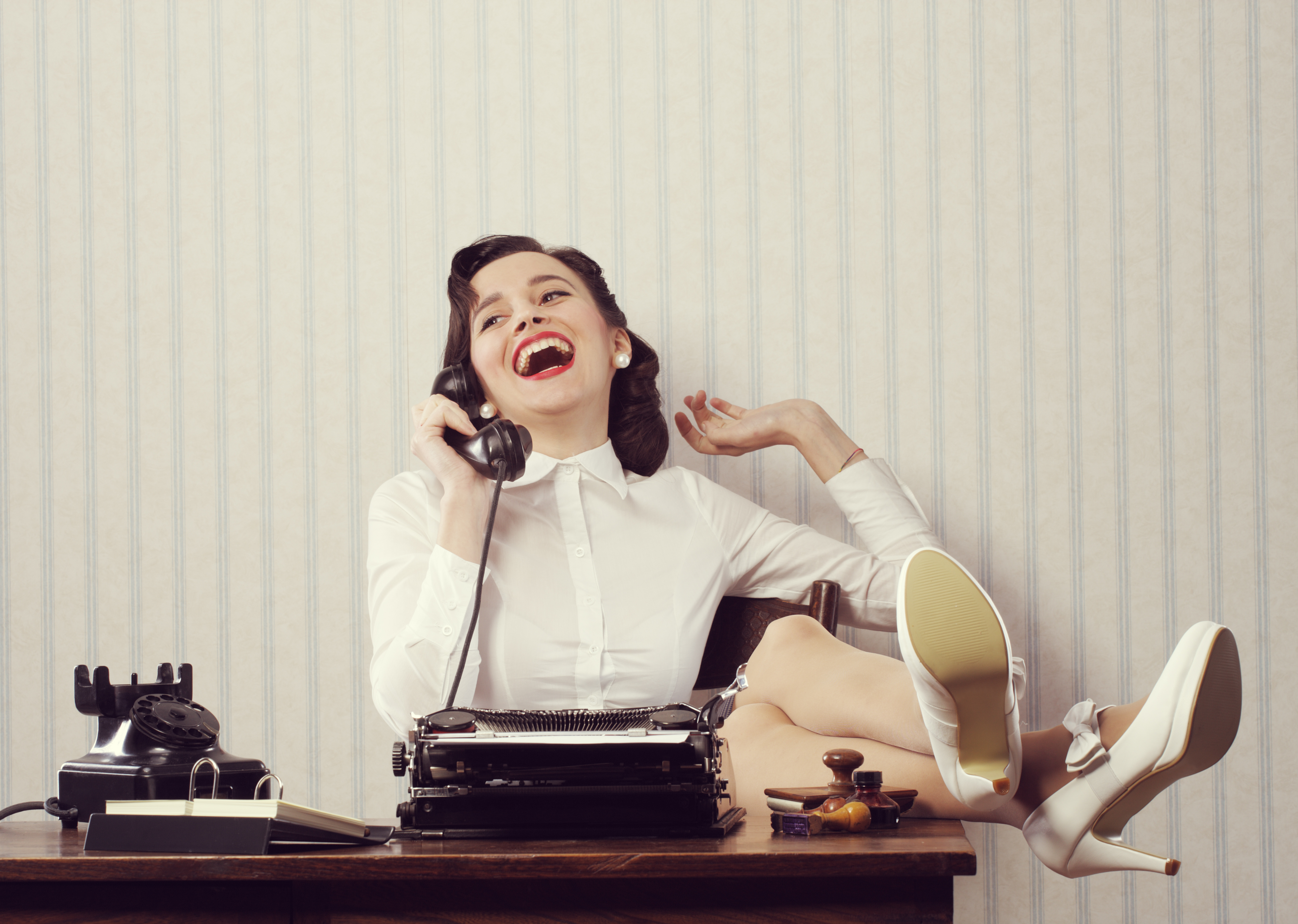 Woman Laughing on a Phone