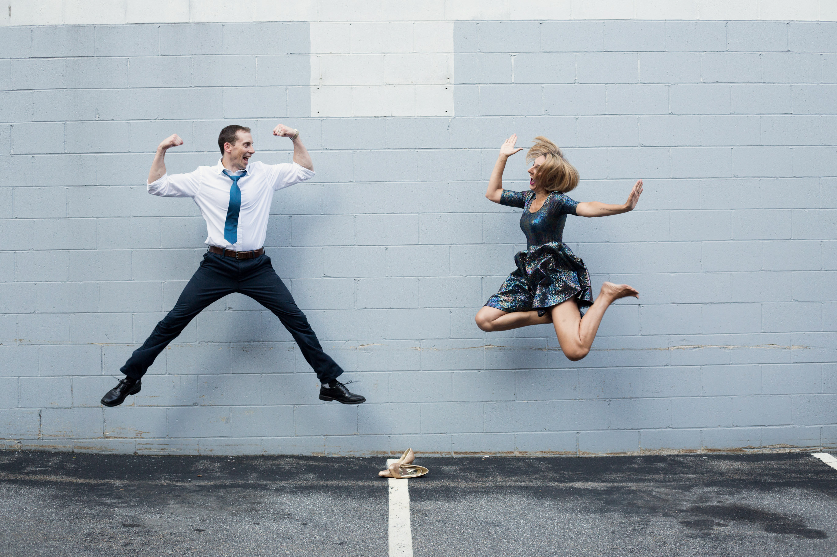 Two People Jumping in the Air